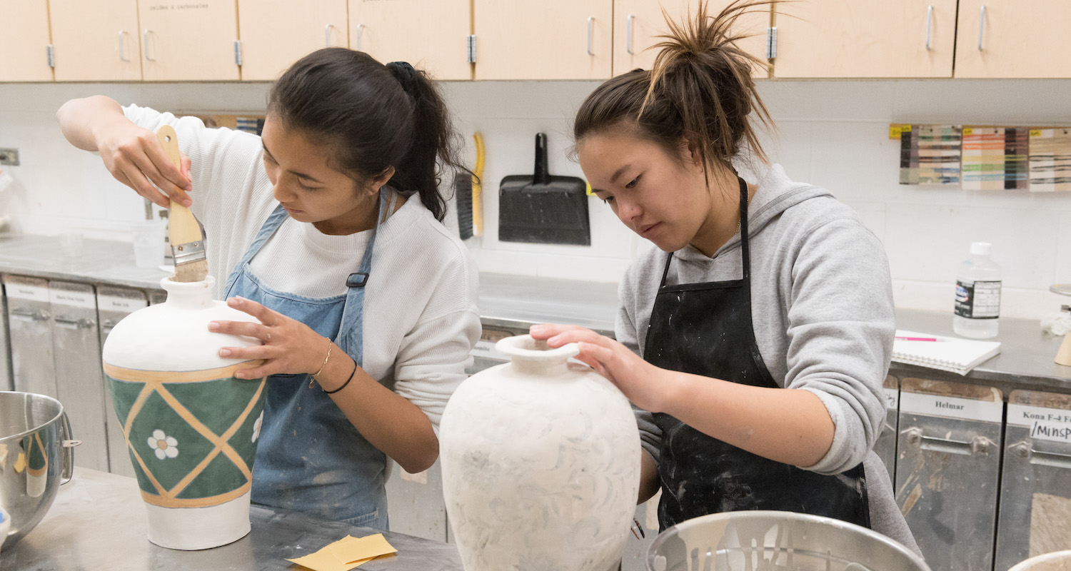 Students working on pottery