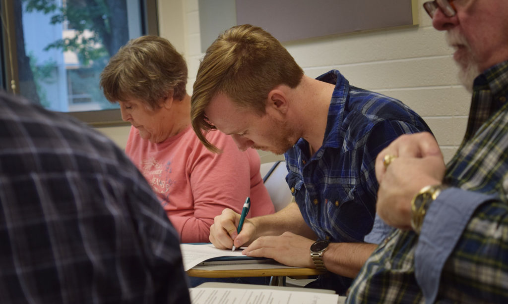 Veterans participating in writing workshop