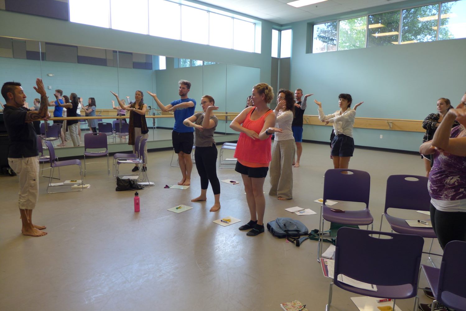 Participants in the Education in Motion seminar making angles with their bodies to enhance geometry lession
