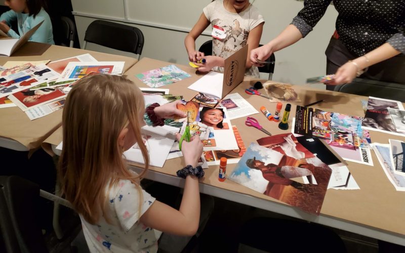 Kids participate in a collage design project, cutting up pictures from magazines to make their own art