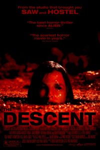Movie poster for "The Descent" featuring a woman's head peering above the surface of a bloody-looking liquid