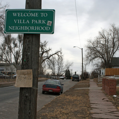 Sign on a street that says "Welcome to Villa Park Neighborhood"