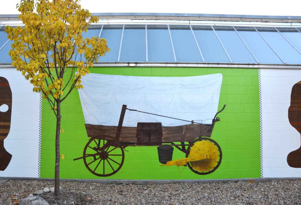 Wide shot of wagon section of the mural. Credit: Ellie Crowley.