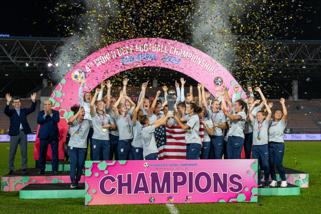 Mia White and U.S. Deaf Women's National Team celebrating their 2023 World Cup win. Photo credit: Joy Marshall Media