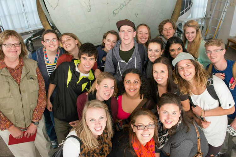 Group of CSU students smiling with Professor Sloane during the 2013 Semester at Sea program.